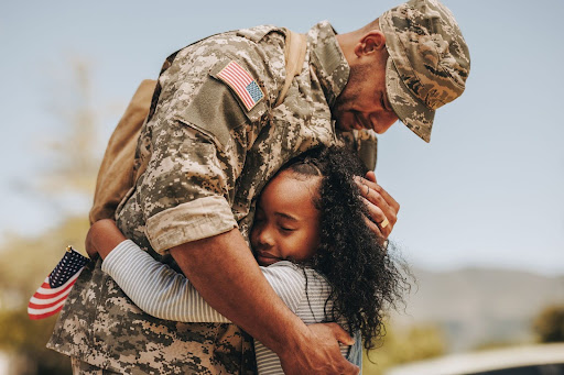 Veteran Soldier Emotionally Embracing Daughter