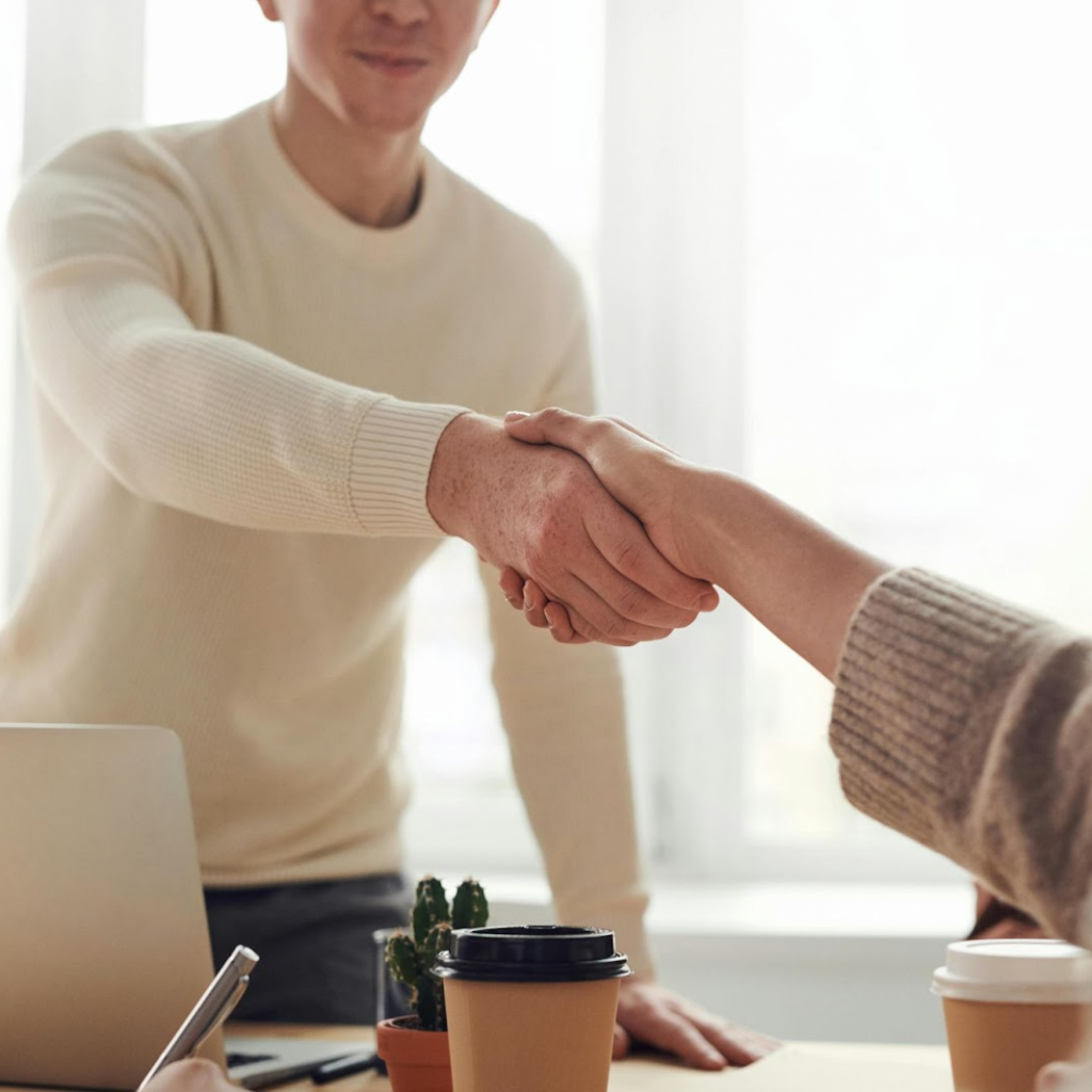 Job interview handshake between veteran and employer